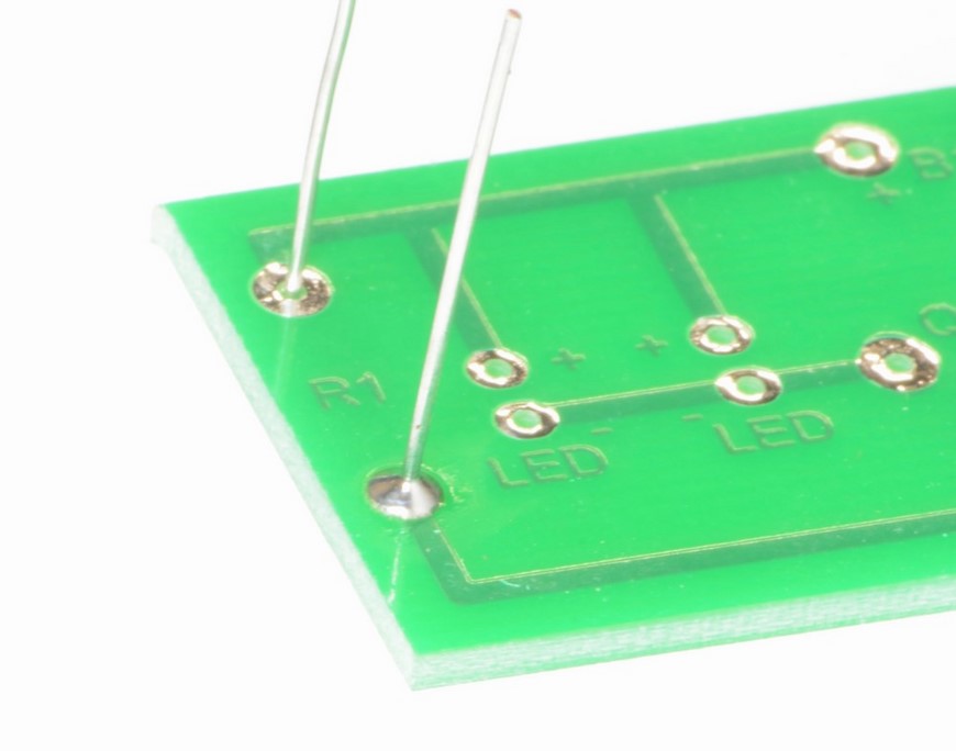 Image of wire correctly soldered to a printed circuit board pad