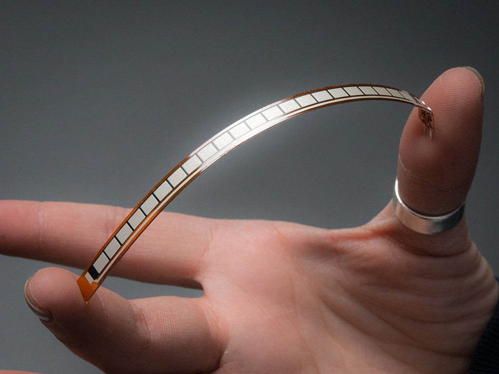 Long Flex Sensor being flexed between middle finger and thumb