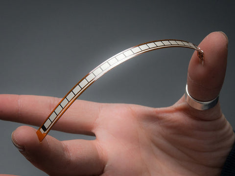Long Flex Sensor being flexed between middle finger and thumb